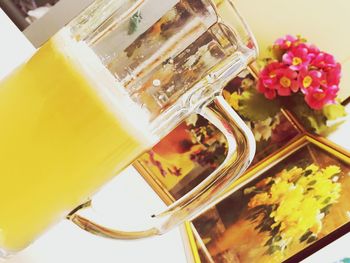 Close-up of yellow jar on table