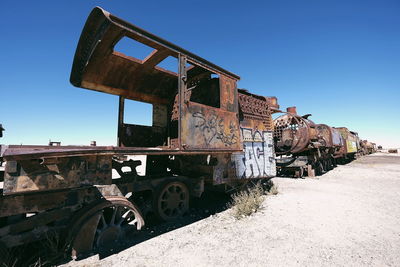 Abandoned train against clear sky