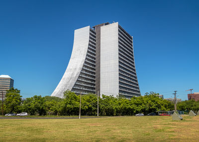 Low angle view of building against clear blue sky