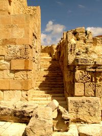 Low angle view of old ruins against sky