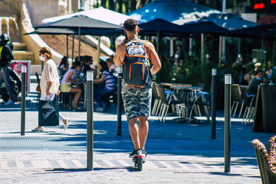 Full length of man on street in city