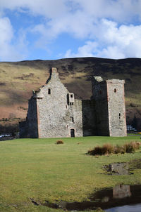 View of old ruin building against cloudy sky