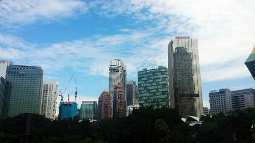 Low angle view of modern buildings against sky