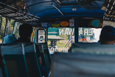 Rear view of people in train
