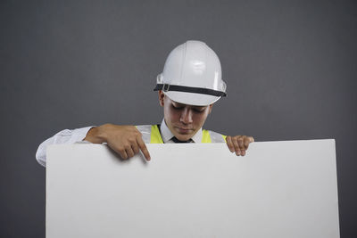 Portrait of man working on floor