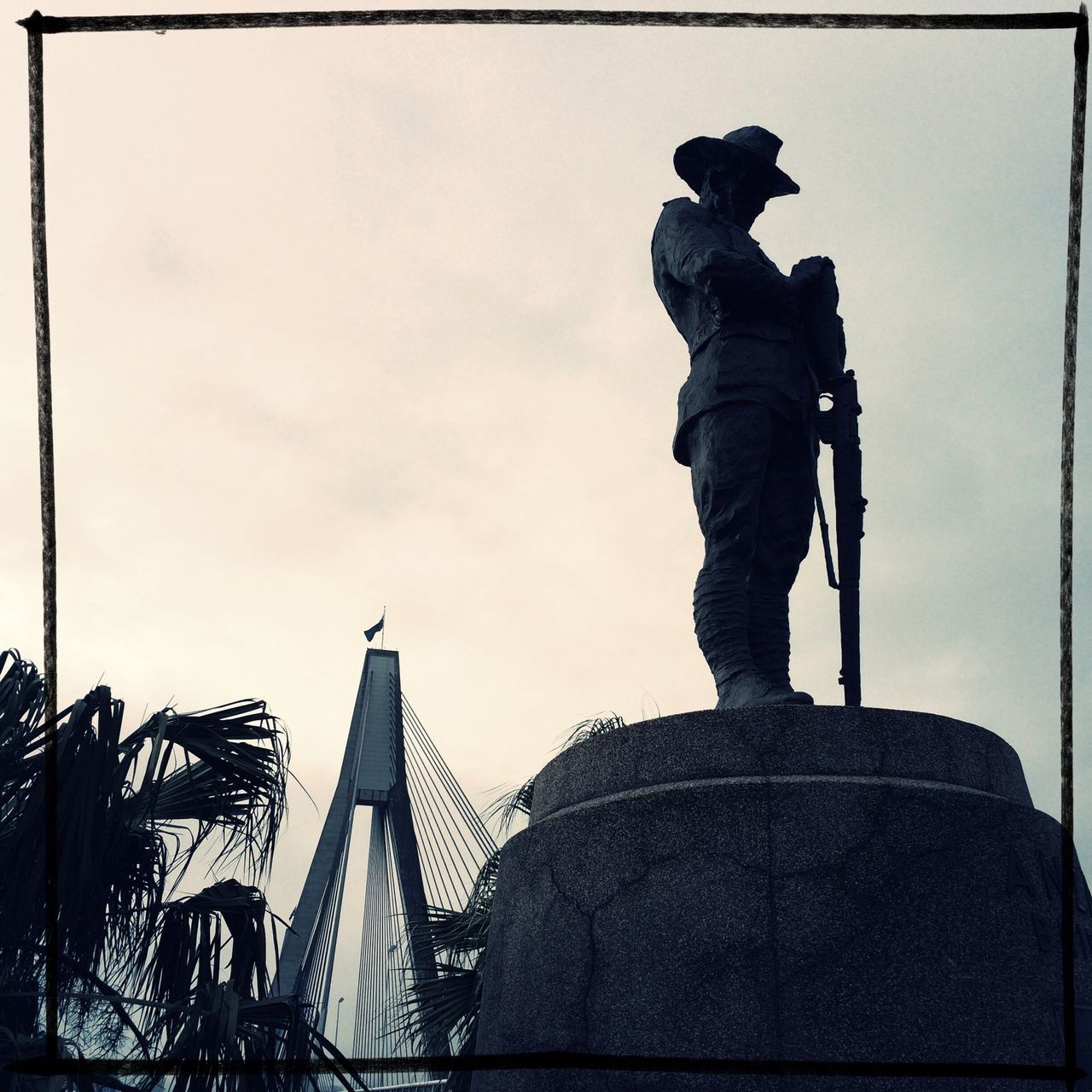 statue, sculpture, transfer print, human representation, sky, art and craft, low angle view, art, architecture, built structure, creativity, auto post production filter, building exterior, famous place, men, international landmark, travel