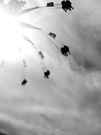 Low angle view of people against sky