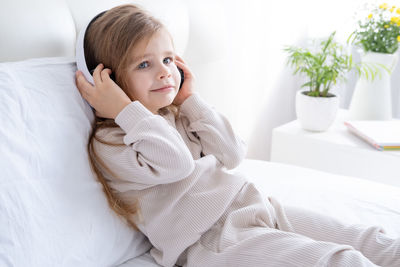 Girl listening music at home