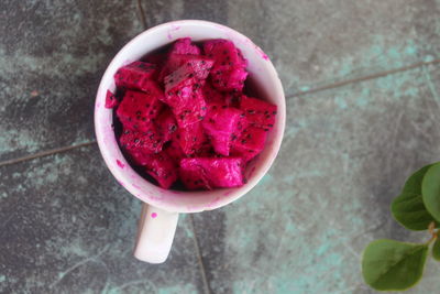 High angle view of red pitaya in bowl