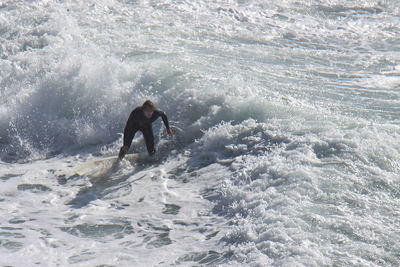 Man surfing in sea