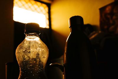 Close-up of wine bottles on table