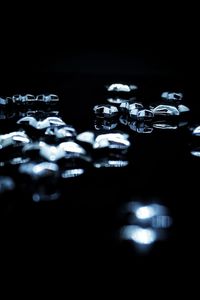 Close-up of water drops against black background