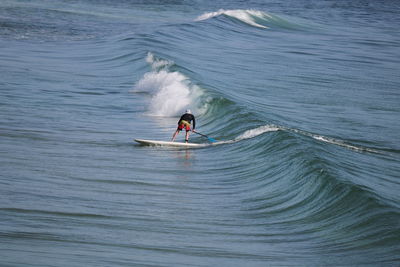 Man surfing in sea