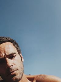 Low angle view of man against clear sky