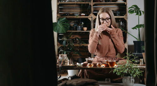 Banner women preparing tea ceremony in boho style atmospheric room oolong chinese drink