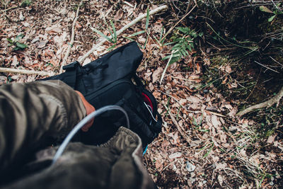 Low section of person lying on field