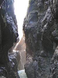 View of waterfall against rock formation