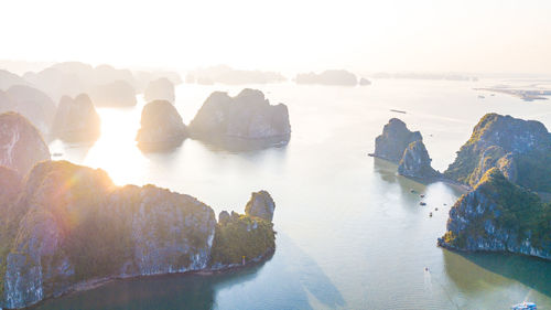 Panoramic view of rocks in sea against sky