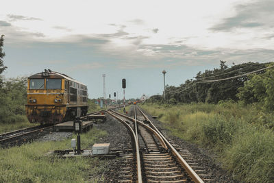 Train on railroad track against sky