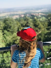 Girl looking off a bridge gazing into the distance