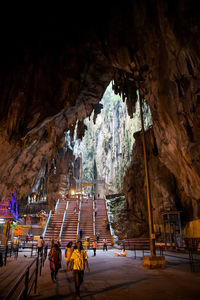 Kuala lumpur, malaysia. worshippers pray inside batu caves hindu shrine