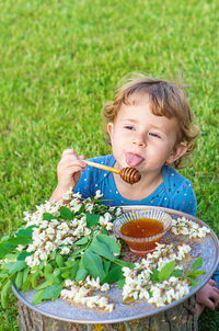 Portrait of cute girl eating food in bowl