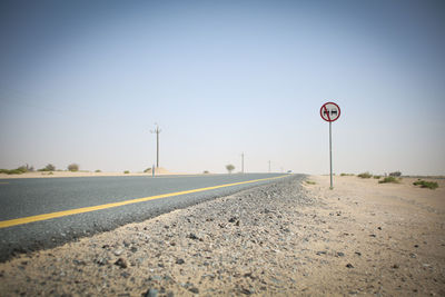 Empty road against clear sky