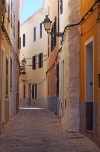 Narrow street amidst buildings in town