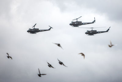 Low angle view of helicopter against sky