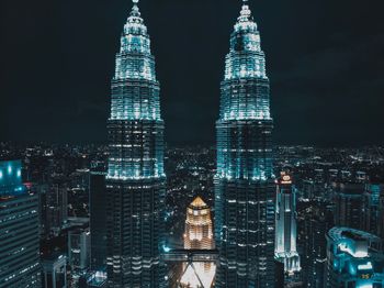 Illuminated buildings in city at night