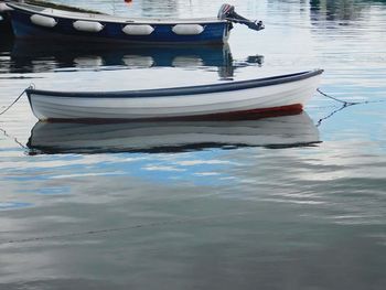 Boats moored in water