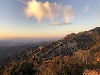 Scenic view of mountains against sky during sunset