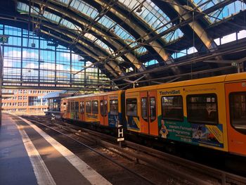 Train at railroad station against sky