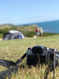 Close-up of camera on field