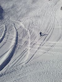 Person skiing on snowcapped mountains