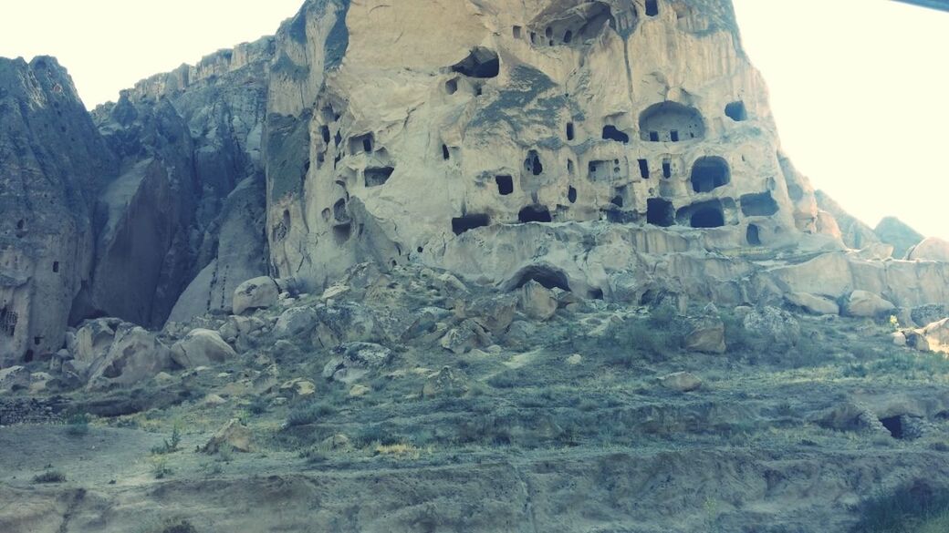 rock formation, mountain, clear sky, rock - object, low angle view, rocky mountains, tranquility, geology, nature, famous place, scenics, tranquil scene, physical geography, travel destinations, non-urban scene, beauty in nature, cliff, eroded, day, rock