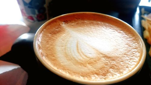 Close-up of coffee cup on table