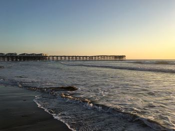 Scenic view of beach against clear sky