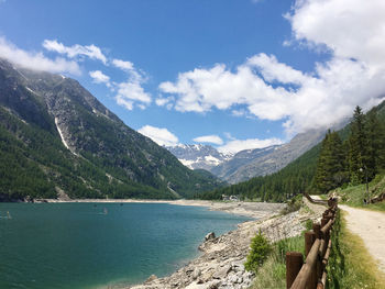 Scenic view of lake and mountains against sky