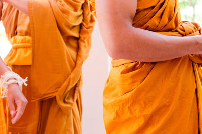 Midsection of woman standing in temple