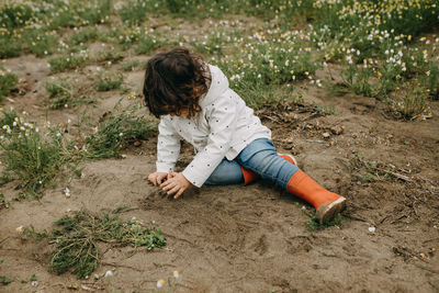 High angle view of girl playing on field