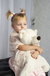 Portrait of cute girl with teddy bear