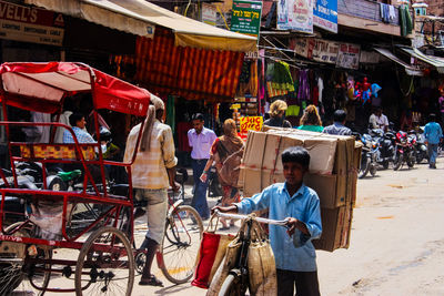 People at market stall in city