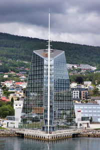 Buildings in city against sky