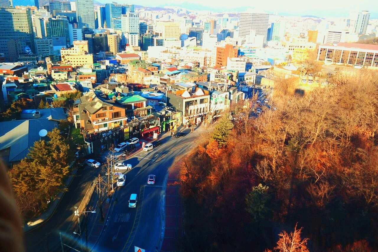 city, street, cityscape, city street, road, transportation, building exterior, aerial view, city life, outdoors, travel destinations, high angle view, architecture, built structure, urban skyline, business finance and industry, no people, sky, urban road, day