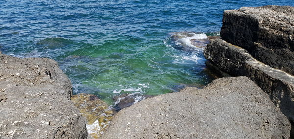 High angle view of rocks on shore