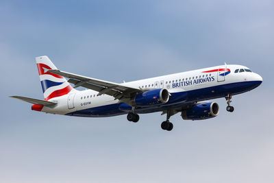 Airplane flying against clear blue sky