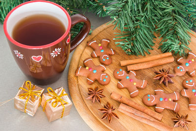 High angle view of gingerbread cookies and spices on table