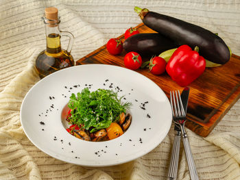 High angle view of vegetables in plate on table