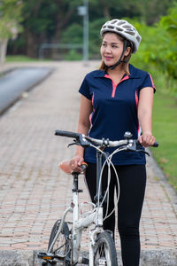 Full length of man riding bicycle